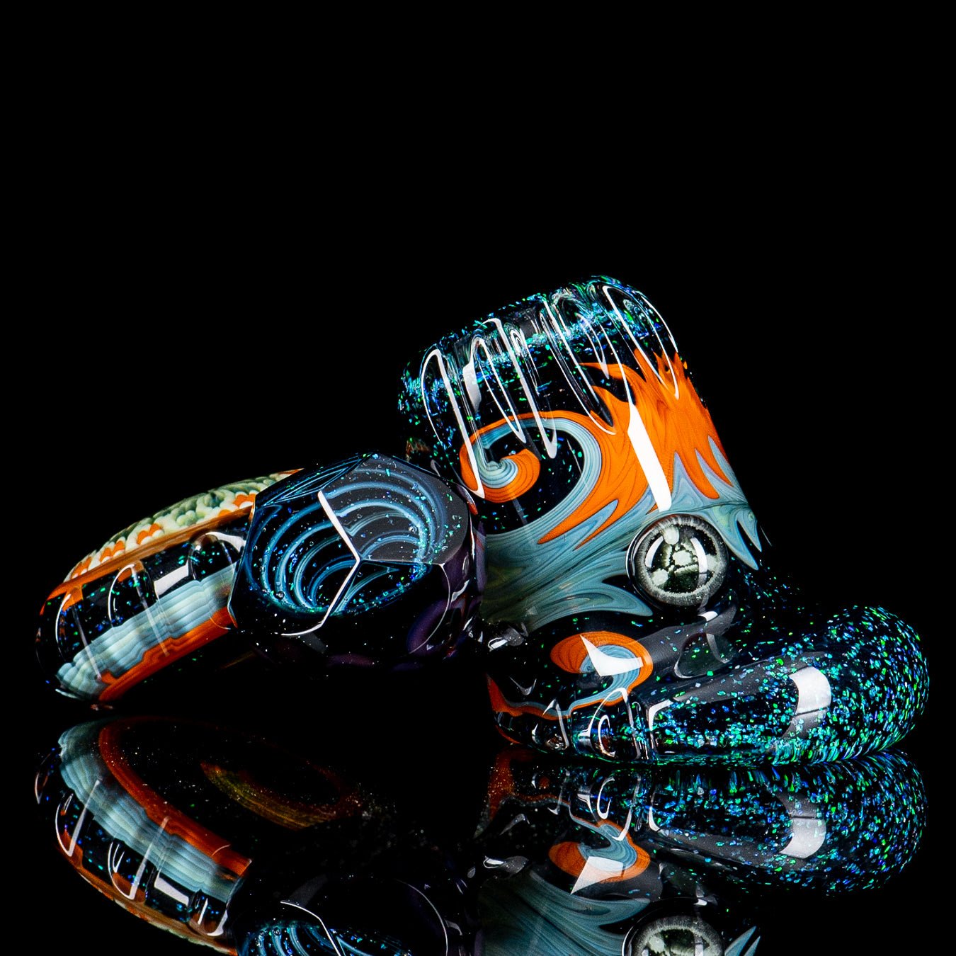 Dichro Pocket Heady Dottacello glass hand pipe by Rotational Science, featuring colorful, shimmering dichroic design and compact shape.