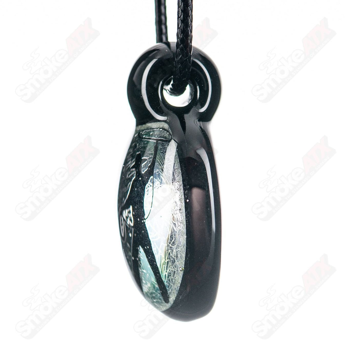 Colorful dichroic glass pendant featuring a turtle design from Turtle Time, crafted with vibrant, reflective glass for a unique jewelry piece.