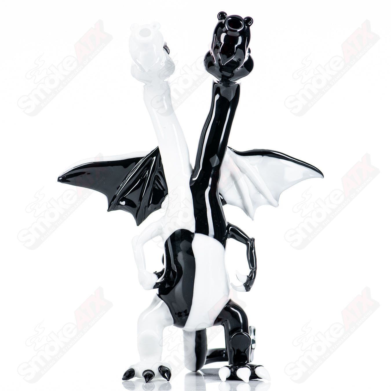 Hendy double-headed dragon glass concentrate rig with intricate dragon designs and clear glass construction.