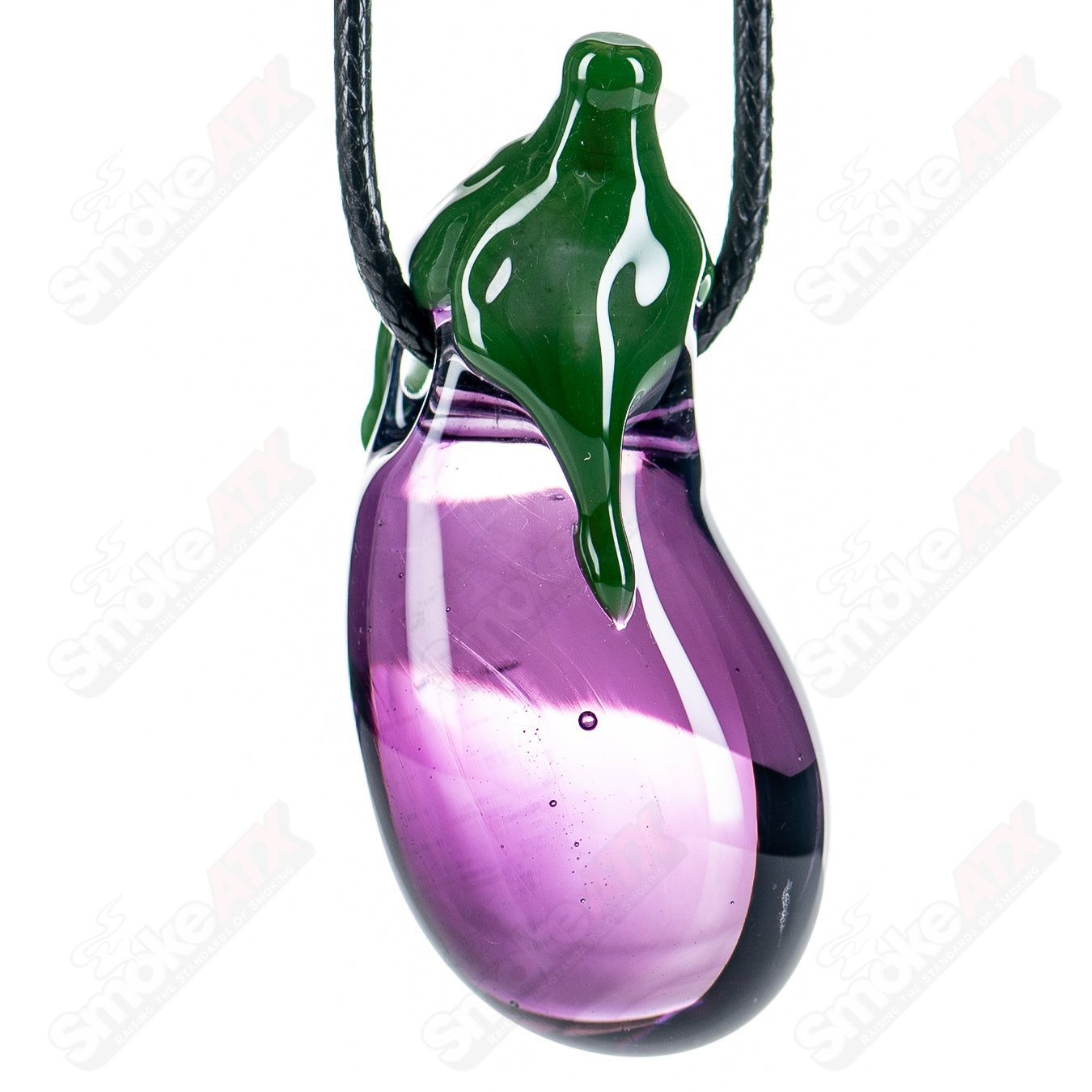 Eggplant-shaped glass pendant by Boots, featuring a vibrant purple design, hanging on a silver chain.