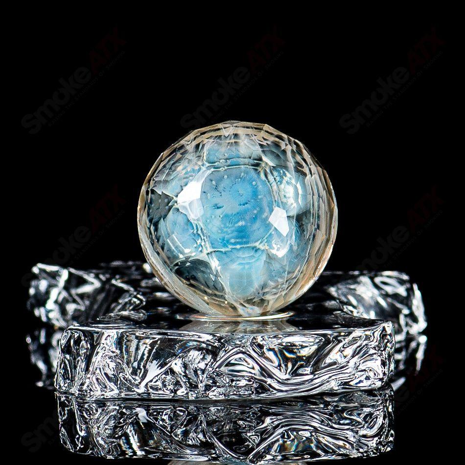 Faceted Ghost Marble with Trefoil S.O.L. pattern by Fatal Facets, heady glass art featuring intricate design and vibrant colors.