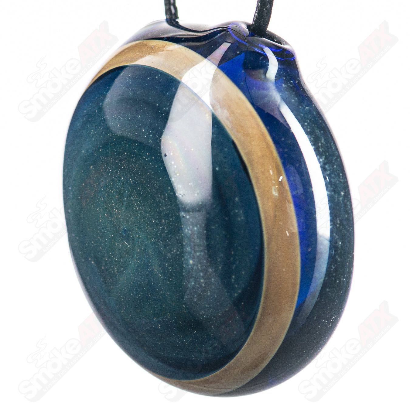 Fume Eclipse pendant made of Tagle Glass, showcasing a smoky, eclipse-inspired glass design hanging from a silver chain.