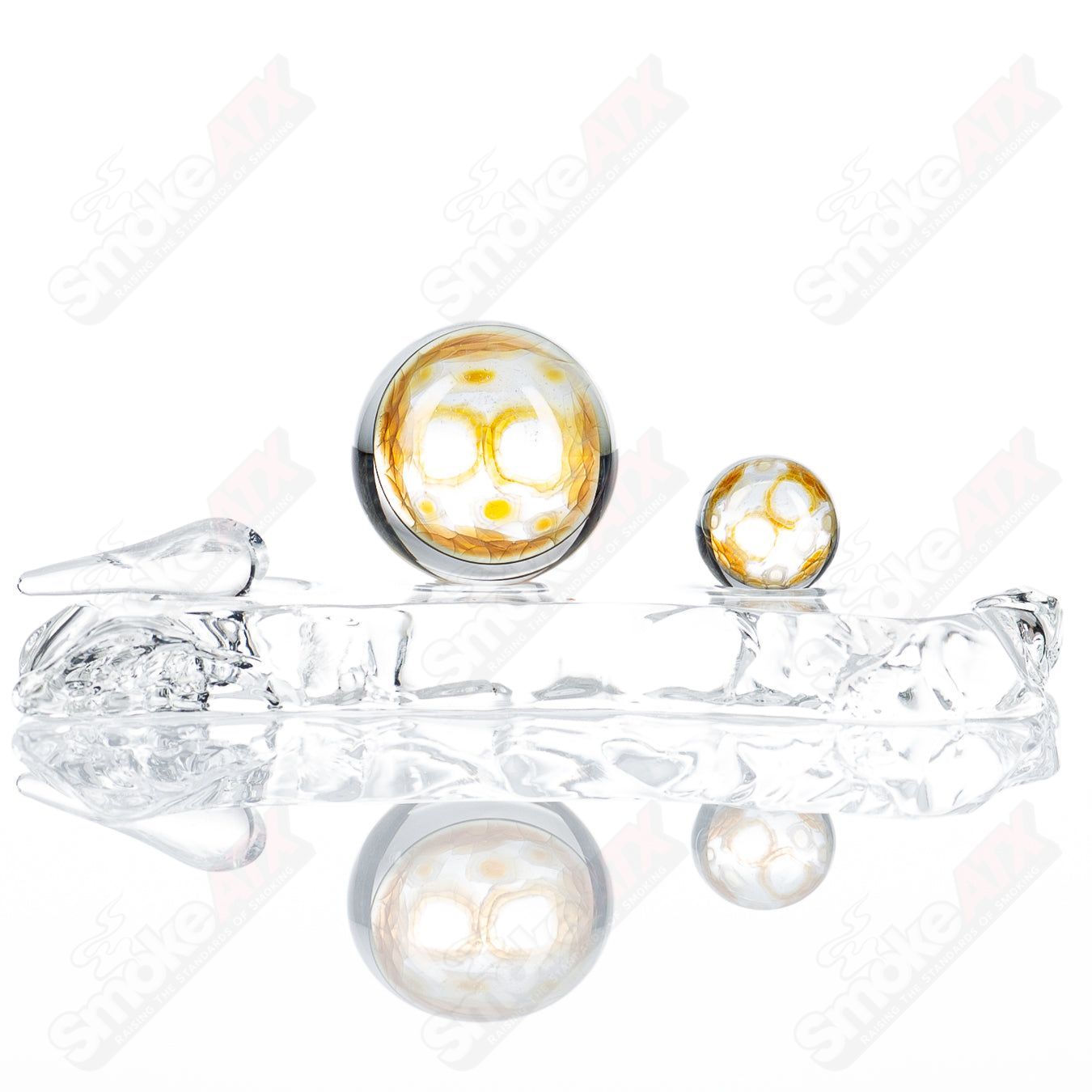 Fume Slurper Marble Set by Indo Glass, featuring colorful glass marbles and a sleek slurper pipe for smoking enjoyment.