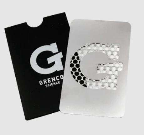 Grenco G Grinder Card vaporizer accessory with compact, foldable design and metal grinding surface for on-the-go herb grinding.