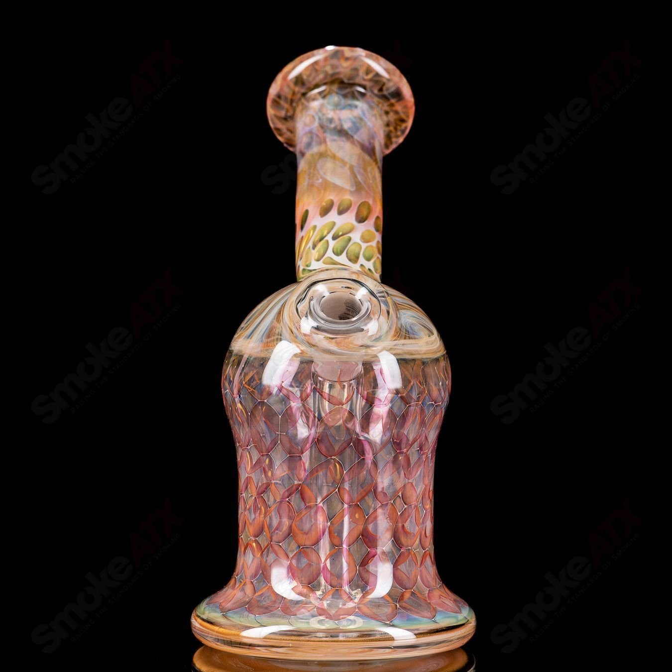 Gold Fume Layback Rig by Nancy Glass, glass concentrate rig with a sleek gold-fumed design and unique layback shape.
