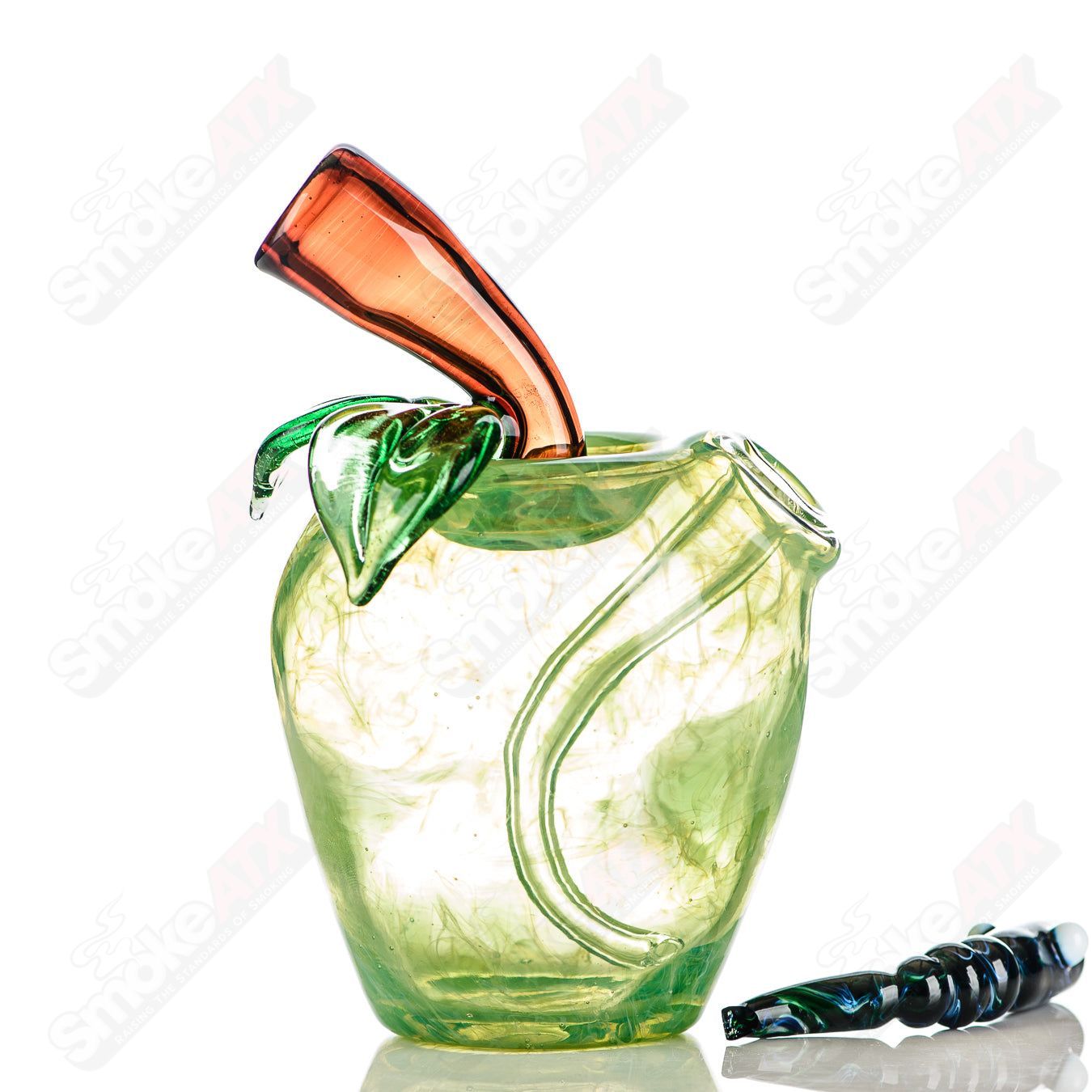 Green apple-shaped rig with a worm dabber pouch, made by Pouch Glass, used for concentrate dabbing in heady glass style.
