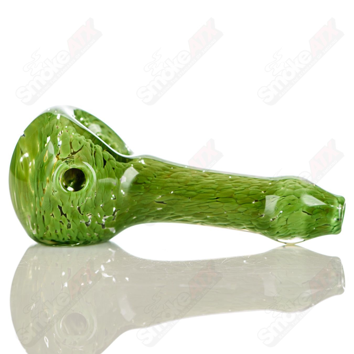 Green Frit glass spoon pipe signed by JMK Glass, featuring vibrant green frit accents and a smooth, rounded bowl.