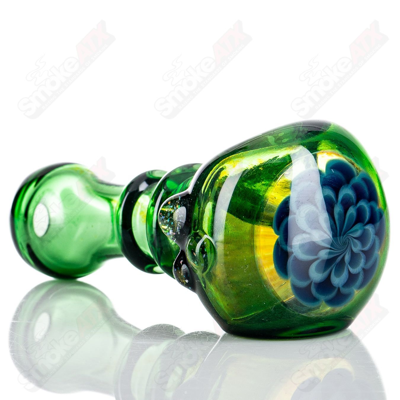 Green spoon hand pipe with crushed opal accents by JMass, featuring a smooth glass heady design for smoking enjoyment.