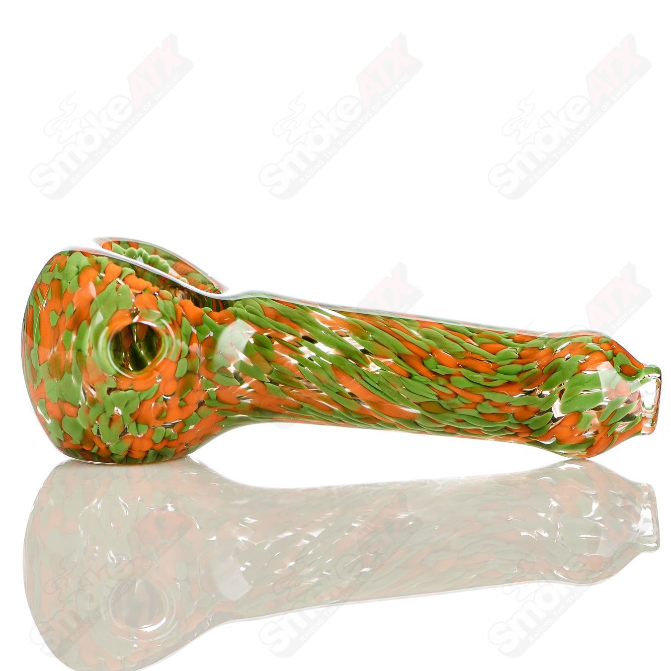 Green and orange frit glass pipe spoon signed by JMK Glass, featuring vibrant color patterns and a smooth glass finish.