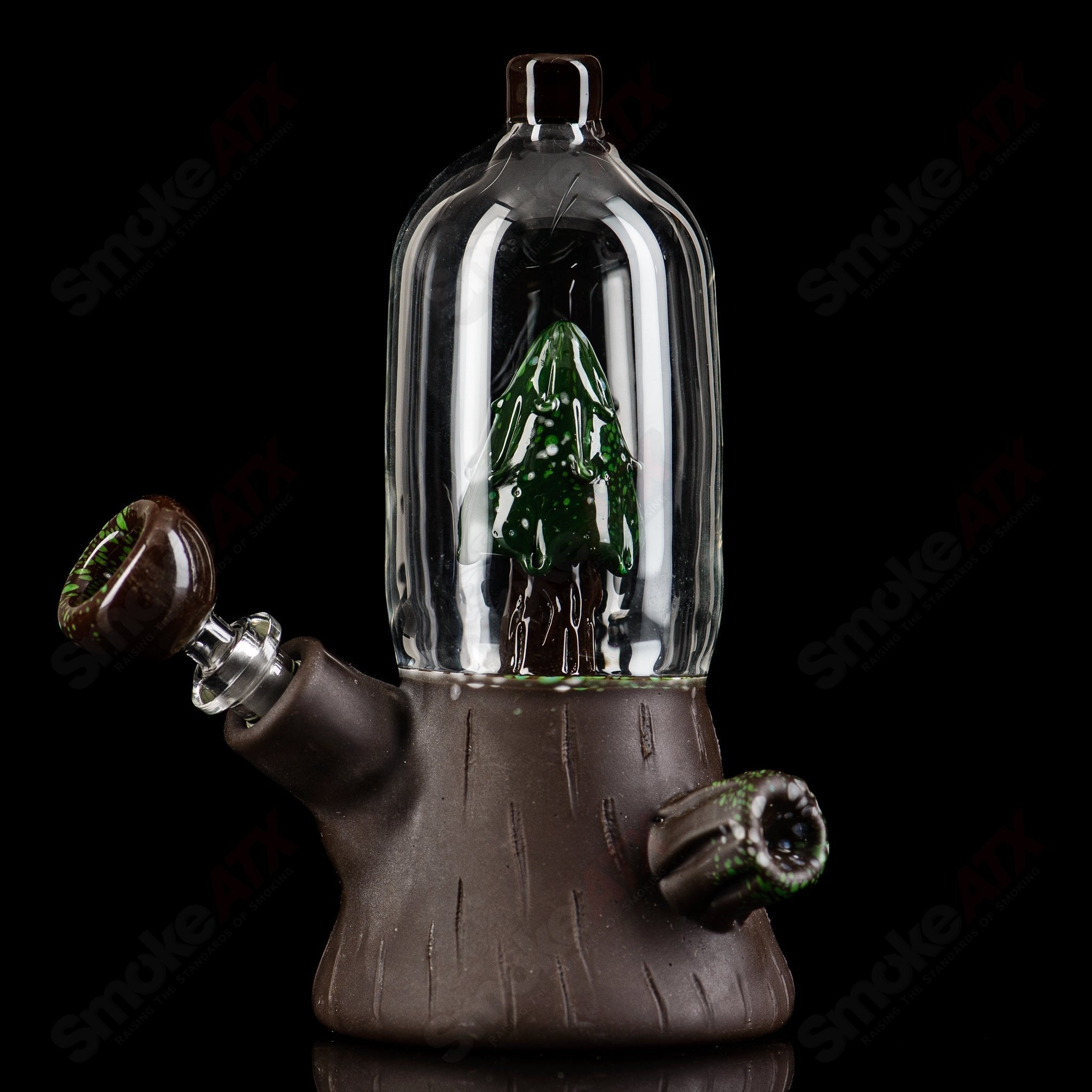 Glass snow dome tube waterpipe by Chad G Glass, featuring a clear design with intricate glass details and a sturdy base.