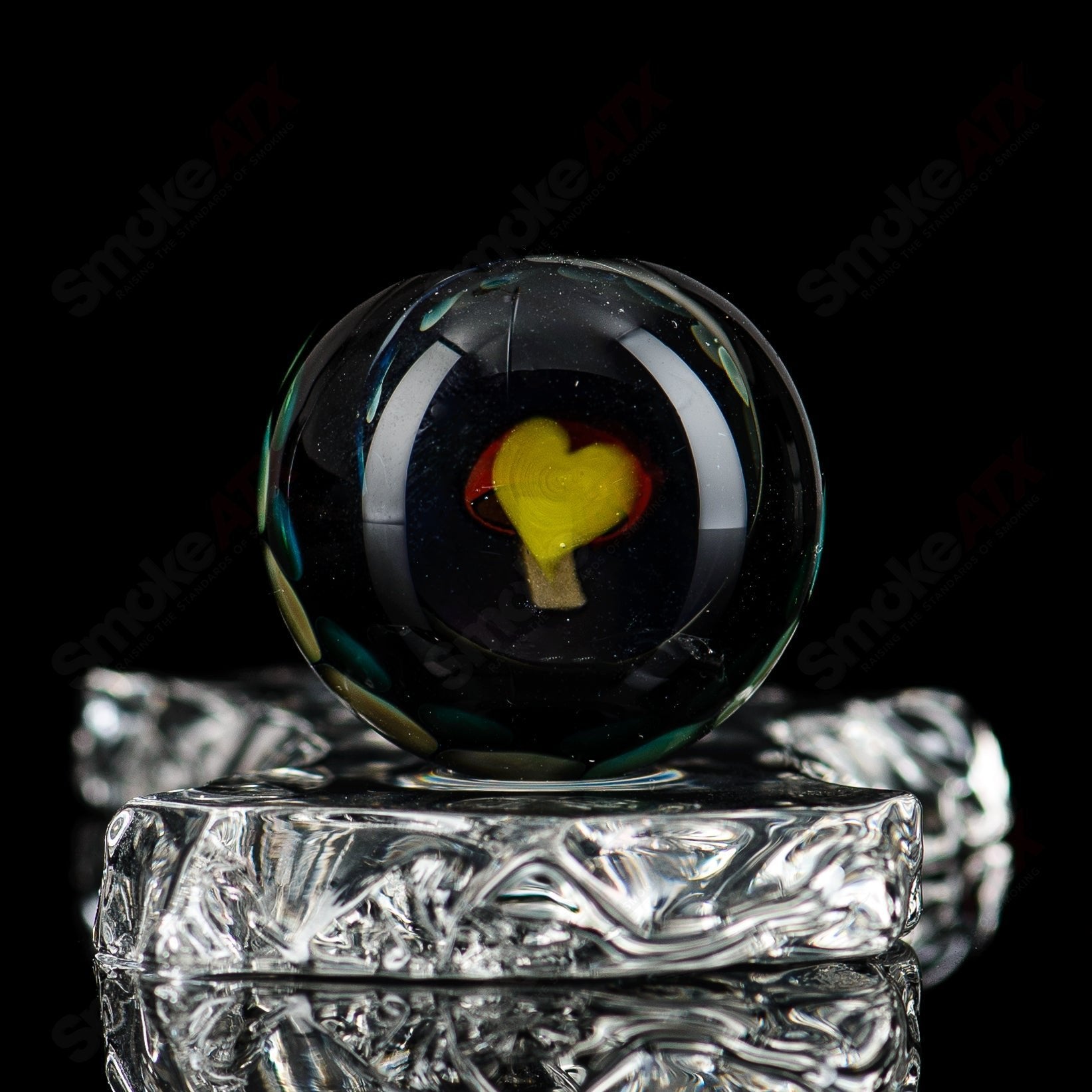 Clear marble glass from Flex Glass featuring a smooth, rounded design perfect for decorative or crafting purposes.