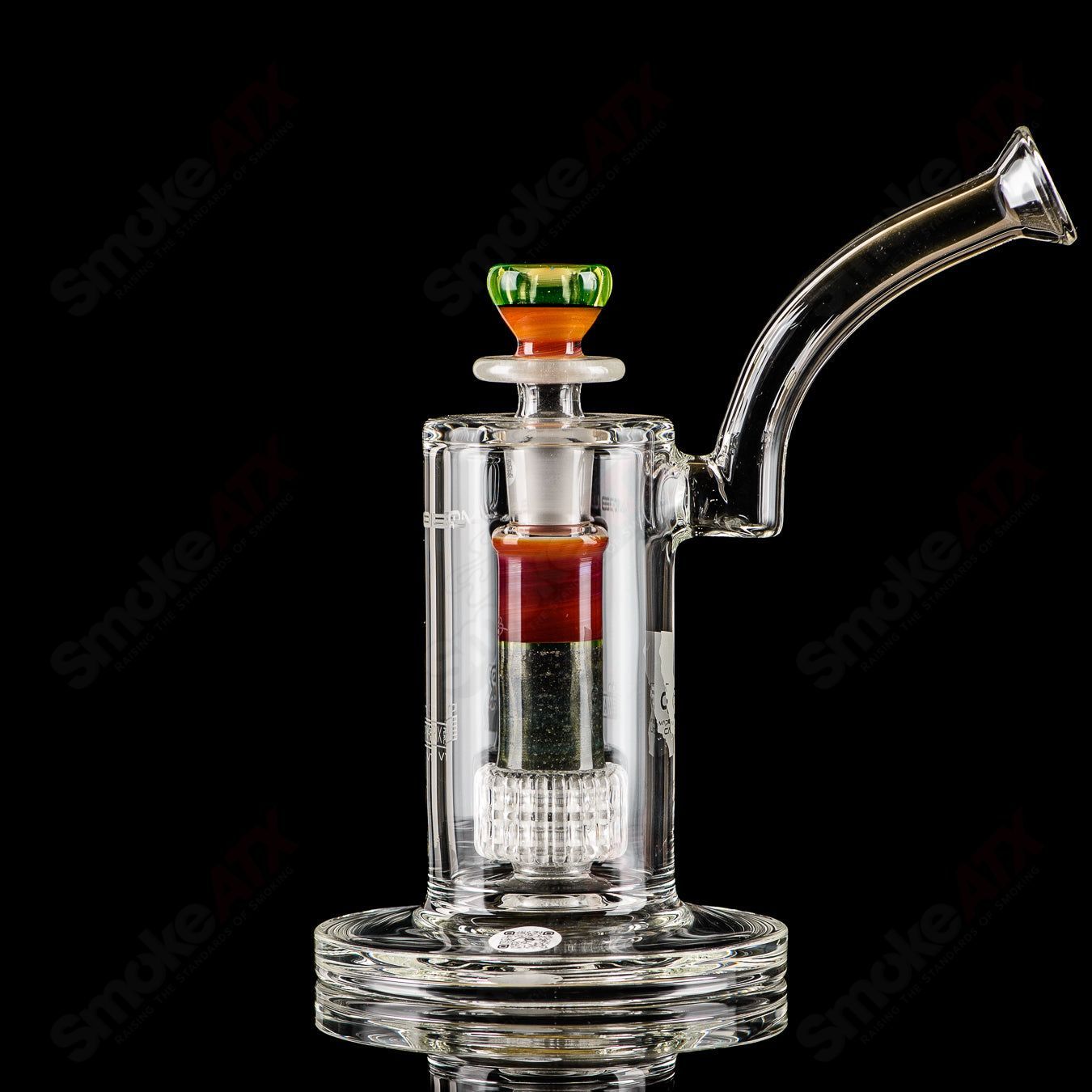 Mobius Ion Matrix V1 Accent Series glass waterpipe with intricate design and clear glass body, featuring vibrant accents and a sturdy base.