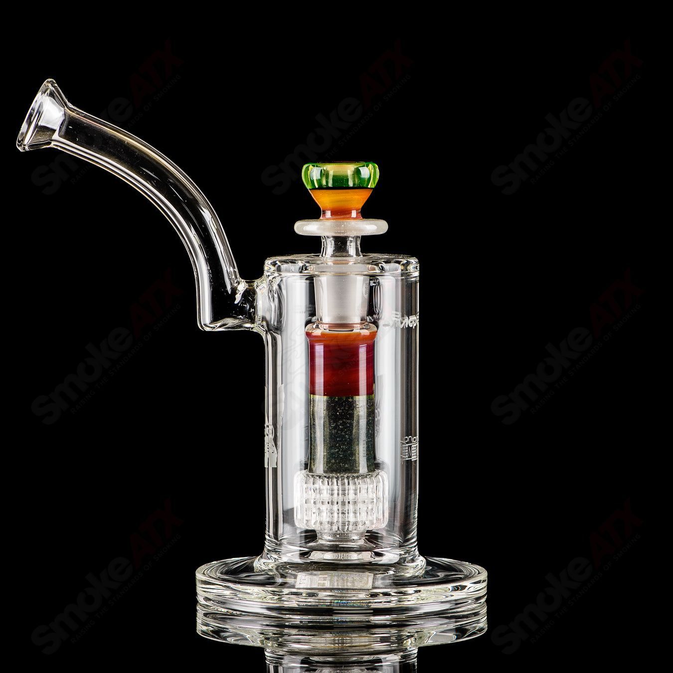 Mobius Ion Matrix V1 Accent Series glass waterpipe with colorful, artistic design and clear glass body for smooth smoking experience