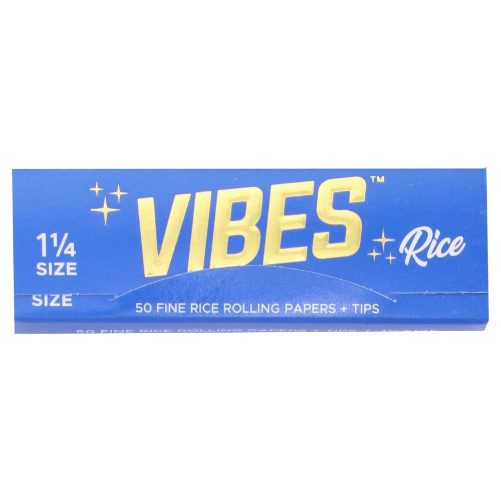 Vibes 1 1/4 rice rolling papers with tips for rolling cigarettes or herbs, shown with papers and tips on a white background.