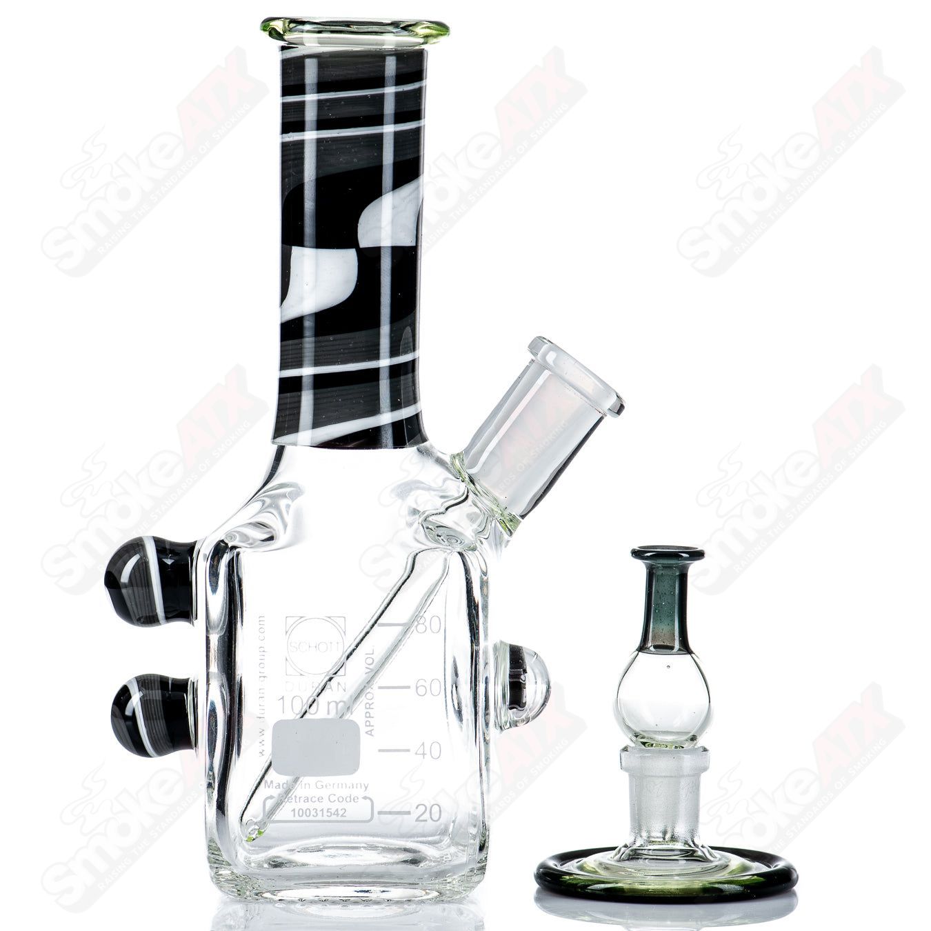 Karl 73 Mini UV Tetris Rig, a glass concentrate rig featuring a vibrant UV Tetris design and compact size.