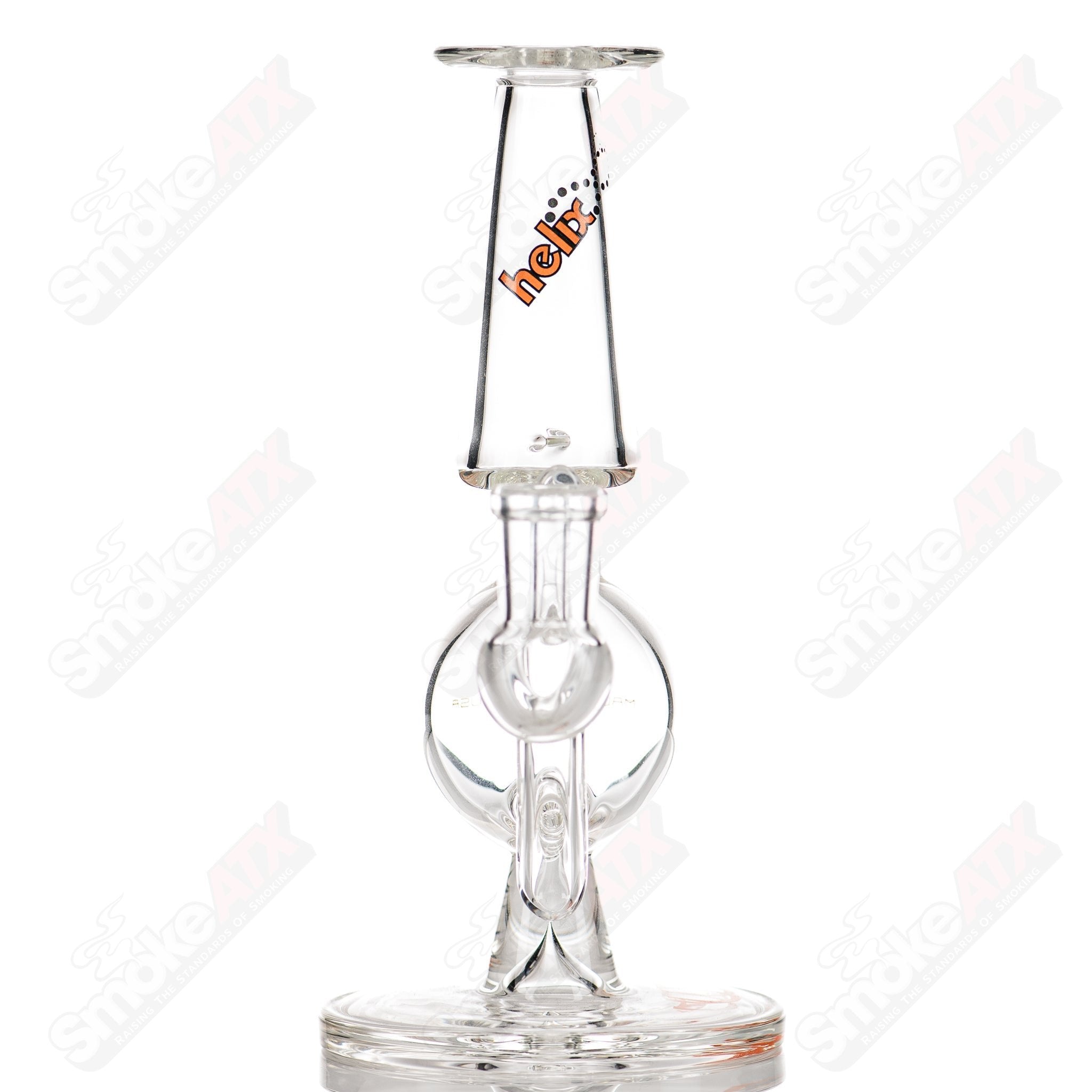 Orange Label Titan Series Helios Helix glass concentrate rig by American Helix, featuring a clear glass design with intricate Helix details.