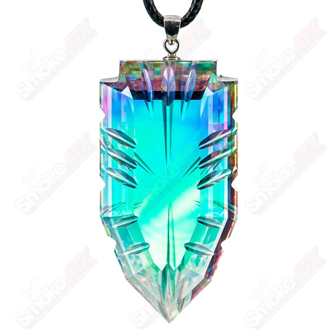 Faceted glass pendant by Fatal Facets, heady glass jewelry with intricate cut patterns and a polished finish.