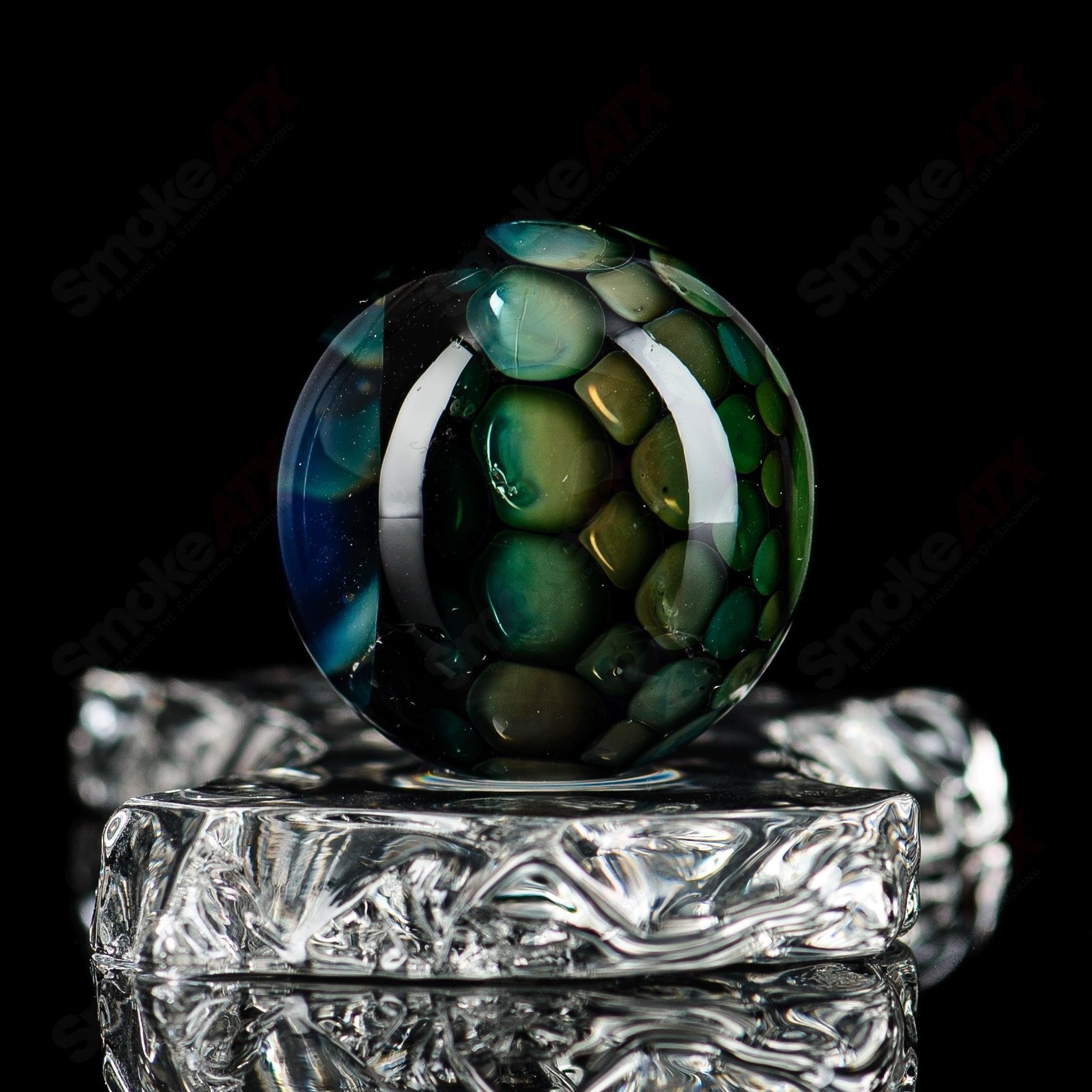 Colorful #2 marble from Flex Glass marble collection, showcasing smooth, glossy glass marbles with a marble pattern.