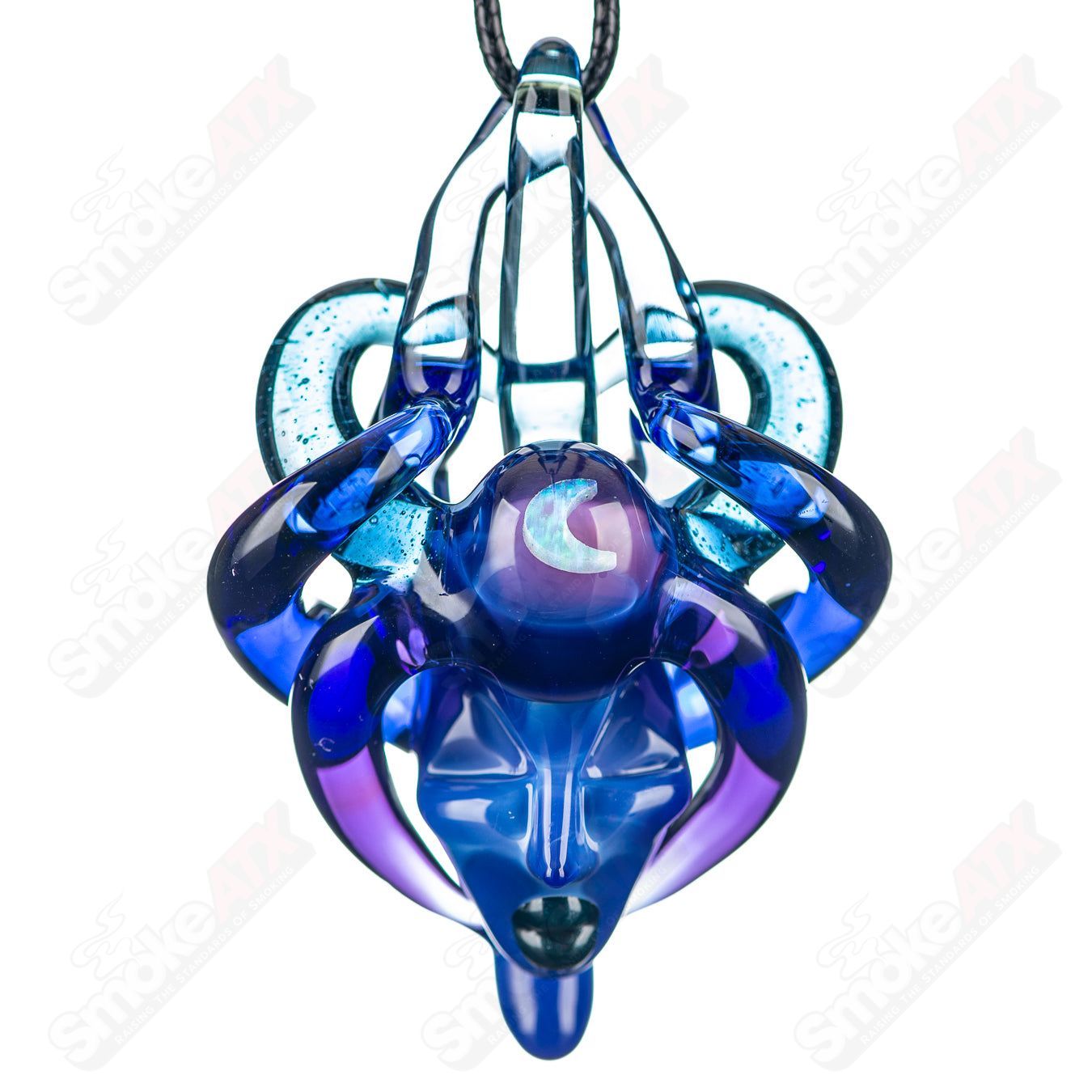 Lace Face Warrior Goddess Pendant made of glass, featuring intricate design and detailed craftsmanship, hangs as a statement jewelry piece.
