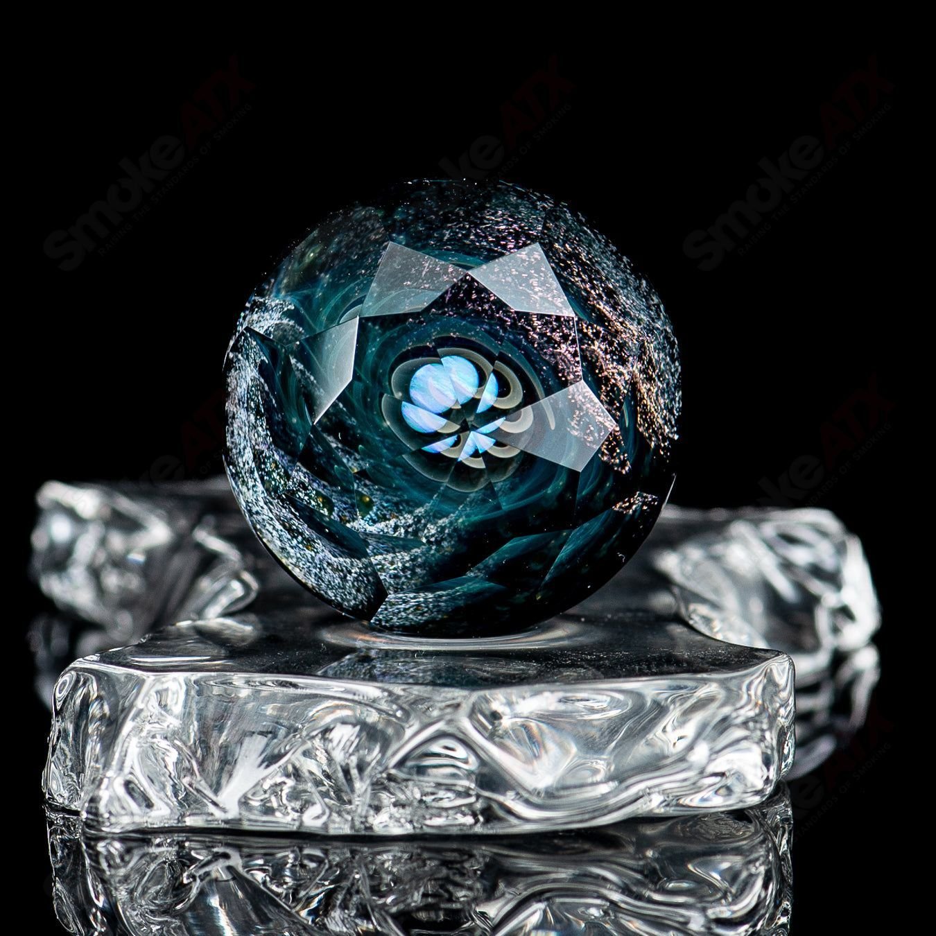 Large Space Slurper marble by Fatal Facets in collaboration with Eric Mort, featuring colorful, swirling glass design.