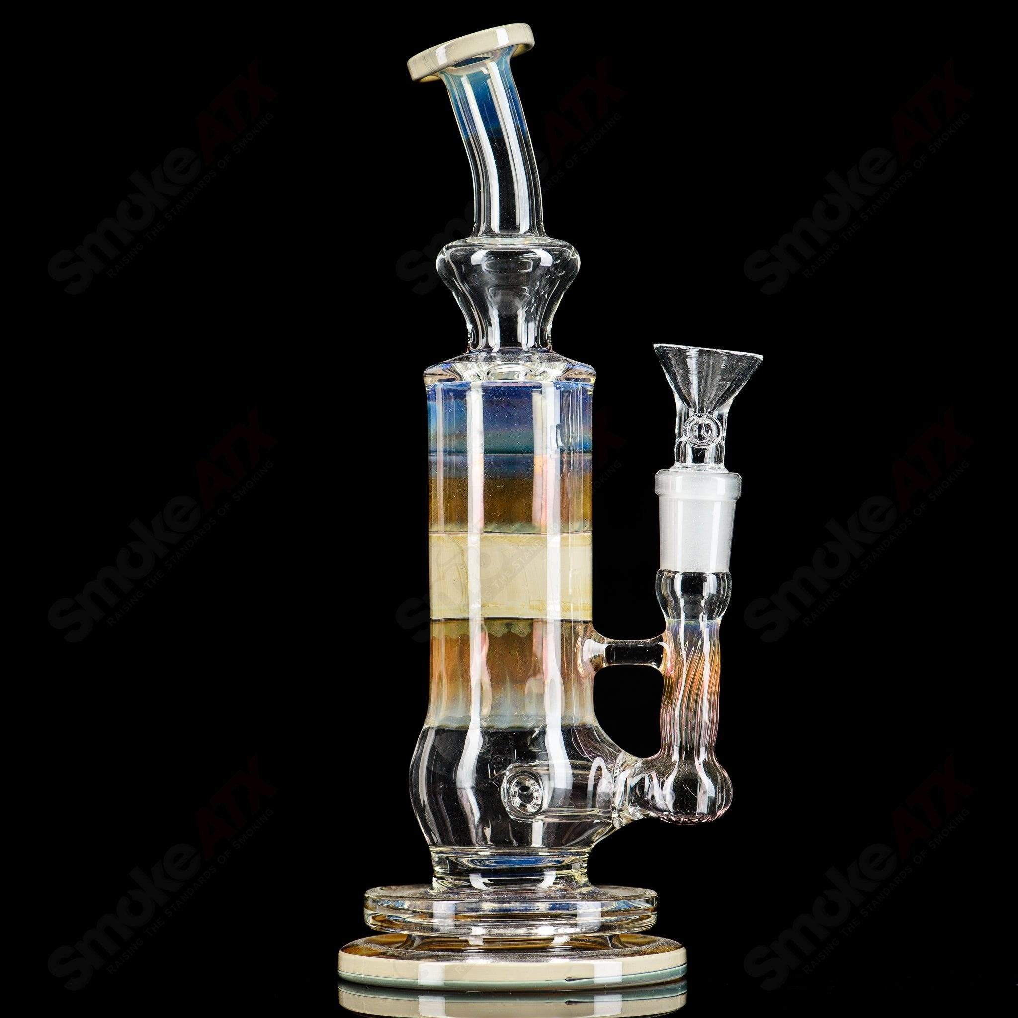 Blue Caramel Fume Rig by Tagle Glass, a detailed glass concentrate rig with vibrant blue and caramel swirl design.