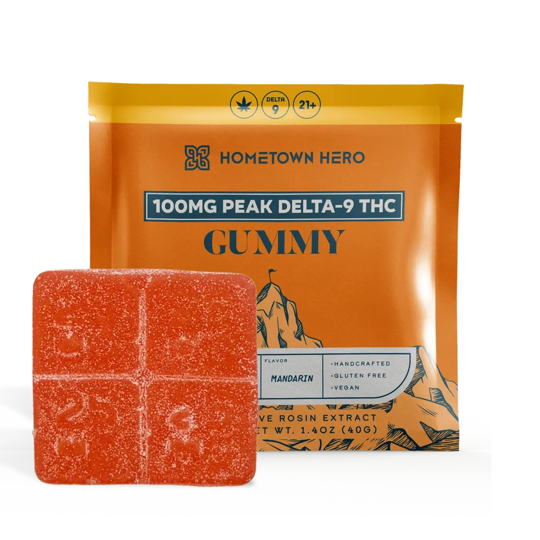 Hometown Hero Mandarin Sour Diesel THC hemp edibles, 100mg Peak D9 Gummies with vibrant orange packaging and gummy shapes inside.
