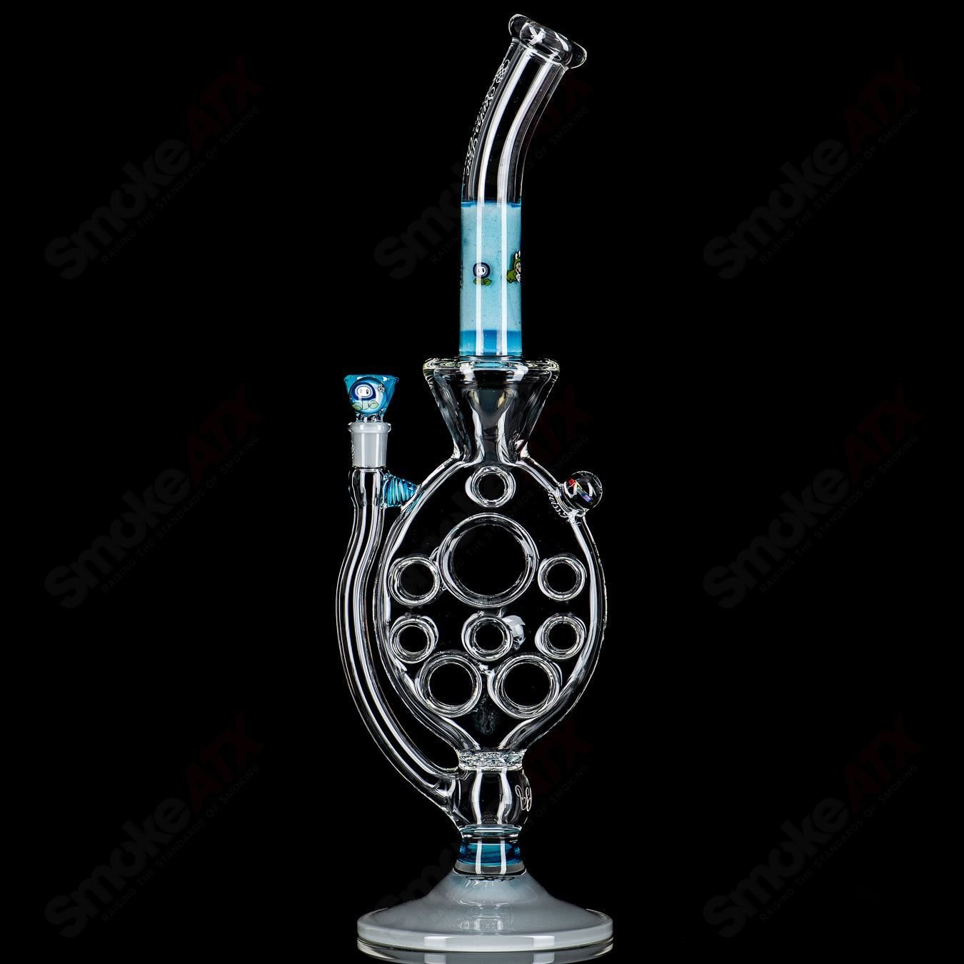 Medium SideFeeder heady glass piece by Swiss Perc x Micro, showcasing a detailed glass design with vibrant colors and intricate craftsmanship.