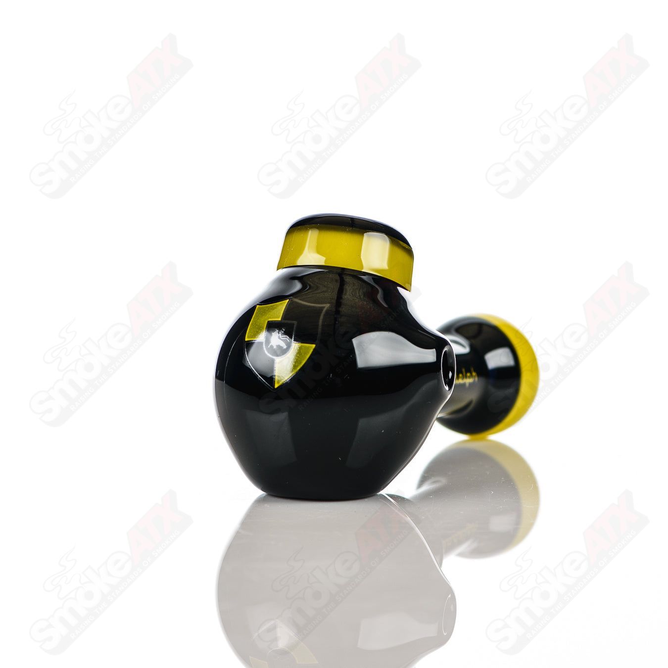 Black and yellow Illadelph glass multi-hole spoon pipe with multiple holes for smooth smoking experience.