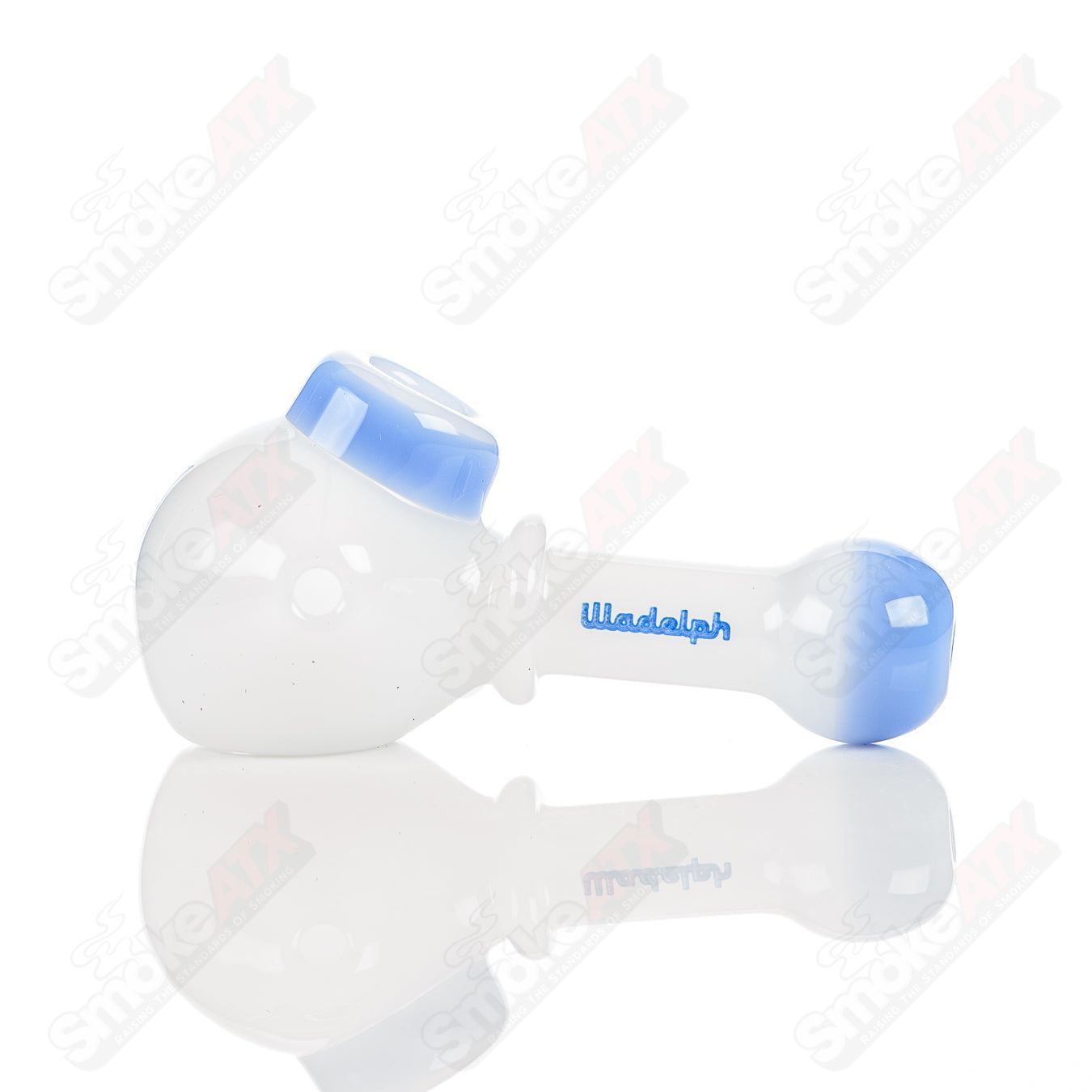 White and blue Illadelph glass multi-hole spoon pipe with multiple air holes for smooth smoking.