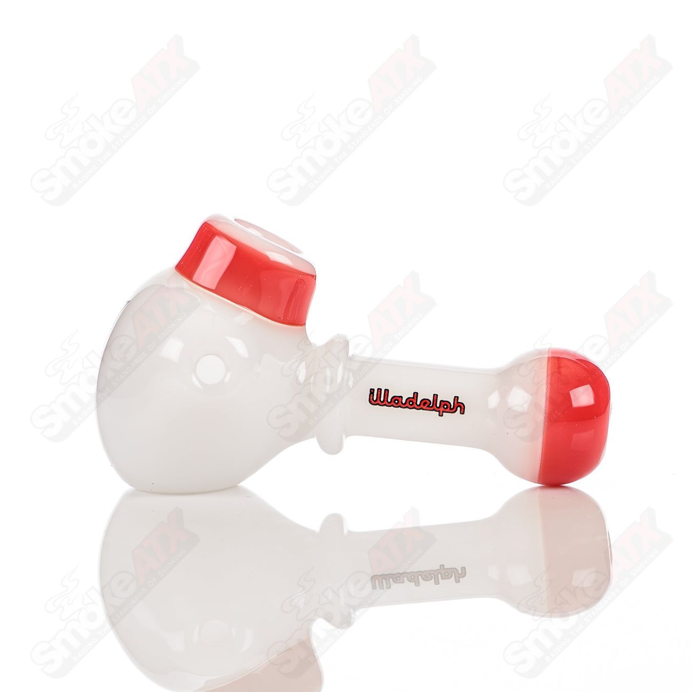 Illadelph white and red glass multi-hole spoon pipe with multiple holes for airflow and a smooth smoking experience.