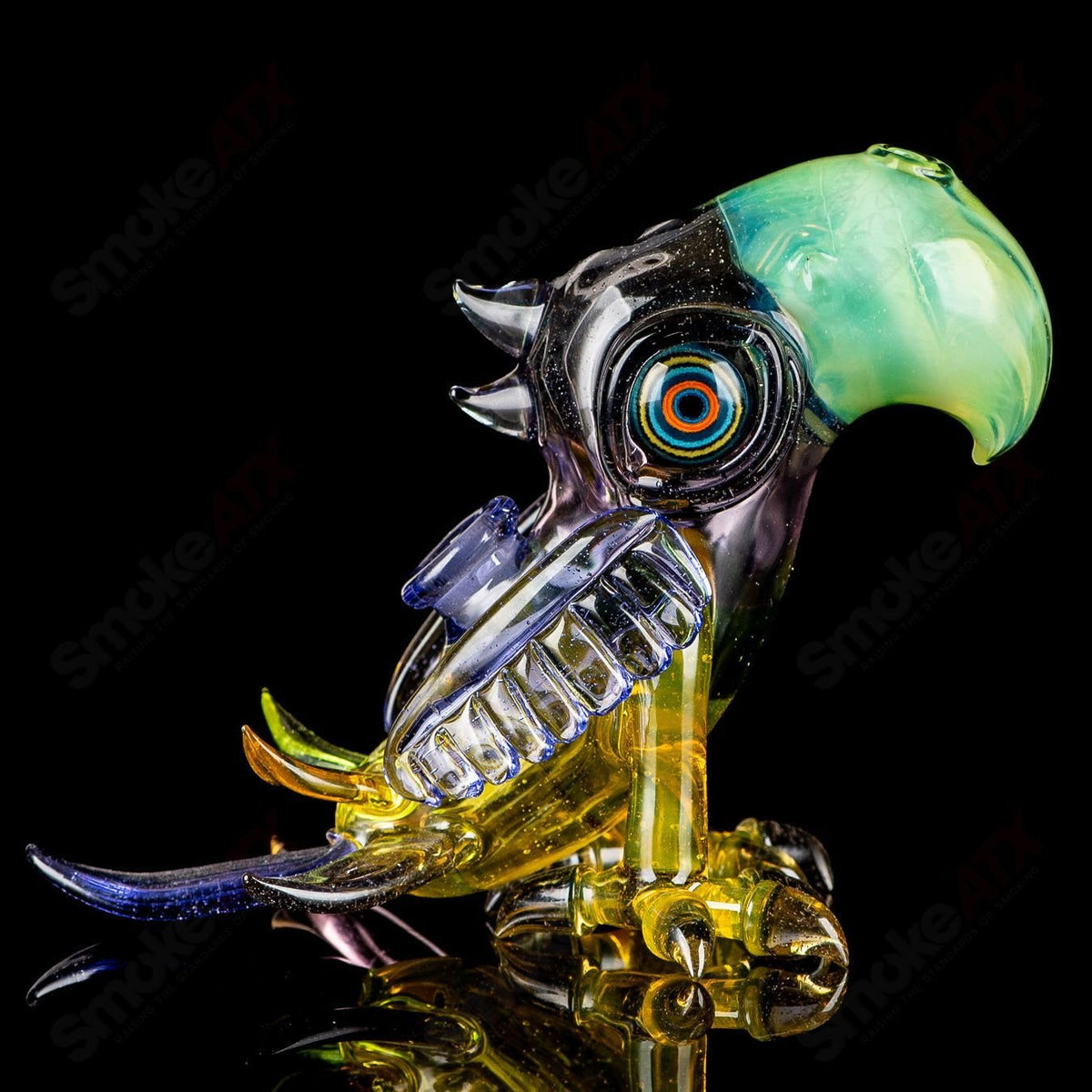 Multicolor Macaw Rig by RJ Glass, a vibrant heady glass concentrate rig featuring a detailed multicolor macaw design.