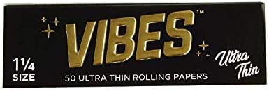 Ultra thin Vibes 1 1/4 rolling papers from 420 Products, showing stacked and unfolded papers for rolling cannabis or tobacco.