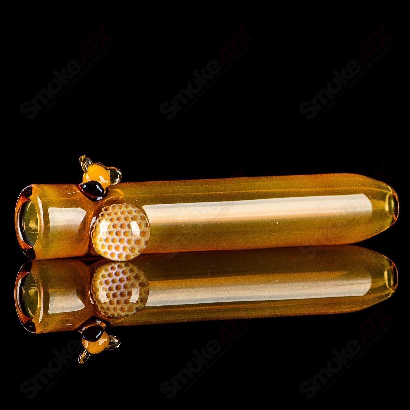 Joe P Glass honeycomb and bee-themed chillum, heady glass one-hitter pipe with intricate honeycomb design and vibrant bee accents.