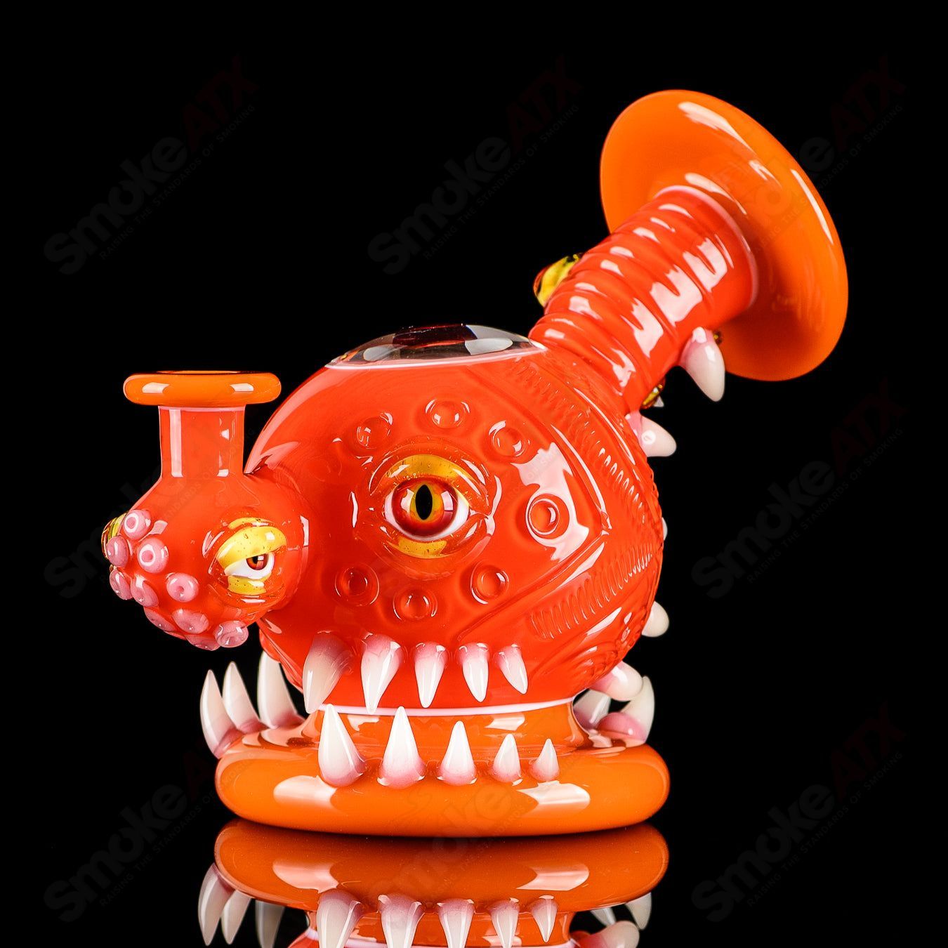 Orange Crayon Orb Rig by SALT & JAG, a colorful glass concentrate rig with a spherical design and intricate glasswork.