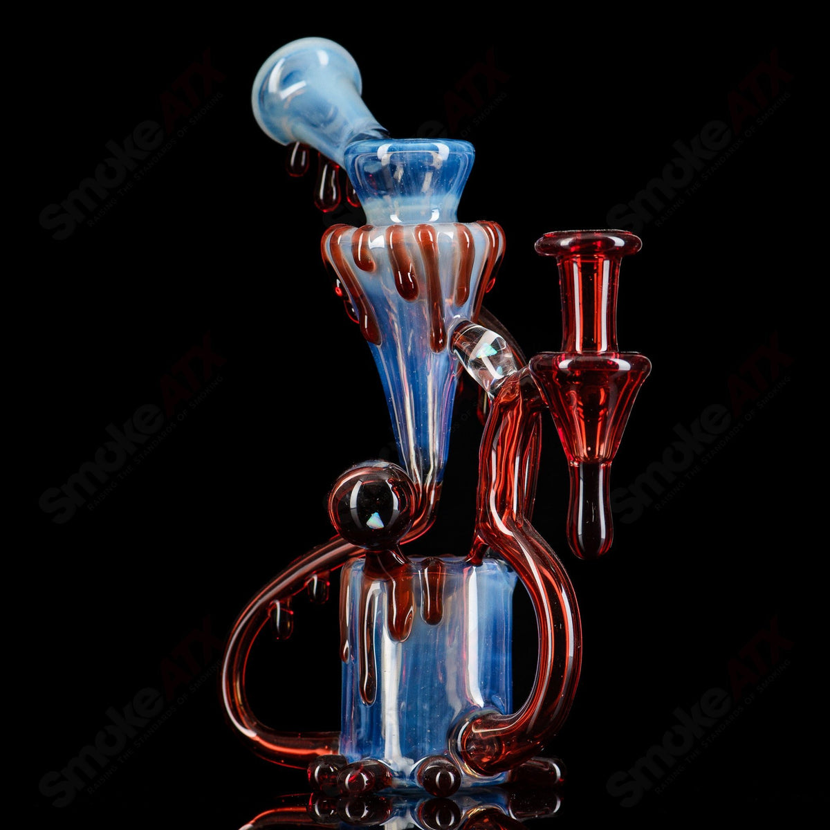 King Leo Drip Recycler King Leo Glass, colorful heady recycler glass piece with intricate drip design and vibrant glasswork.