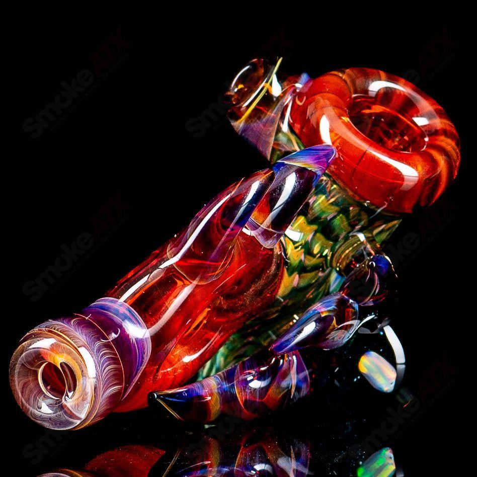 Dosh Glass Piranha Hand Pipe, clear glass heady pipe featuring a detailed piranha design, for dry herbs and smoking.