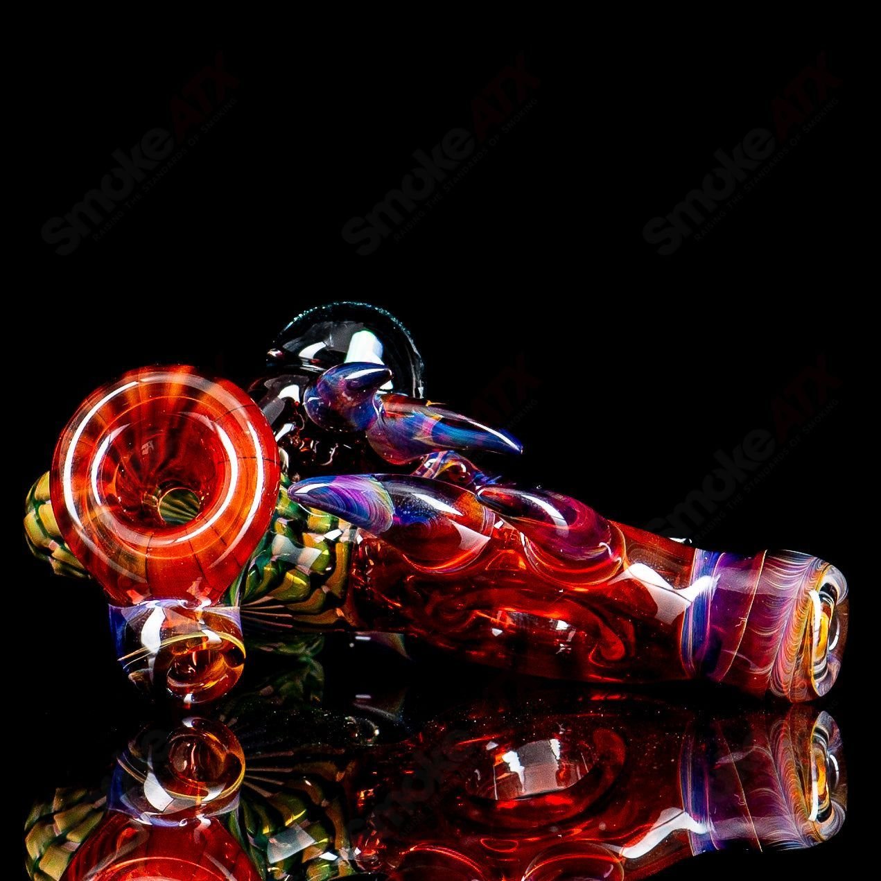 Dosh Glass Piranha Hand Pipe, colorful heady glass smoking pipe with detailed piranha design and smooth glass finish.