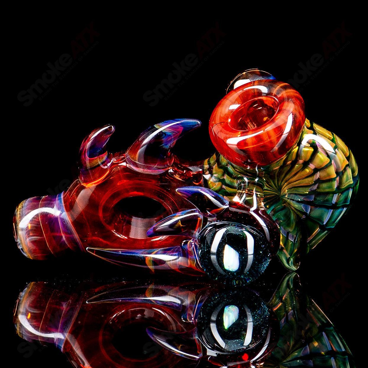 Dosh Glass Piranha Hand Pipe, colorful heady glass pipe with detailed piranha design for smoking or display.