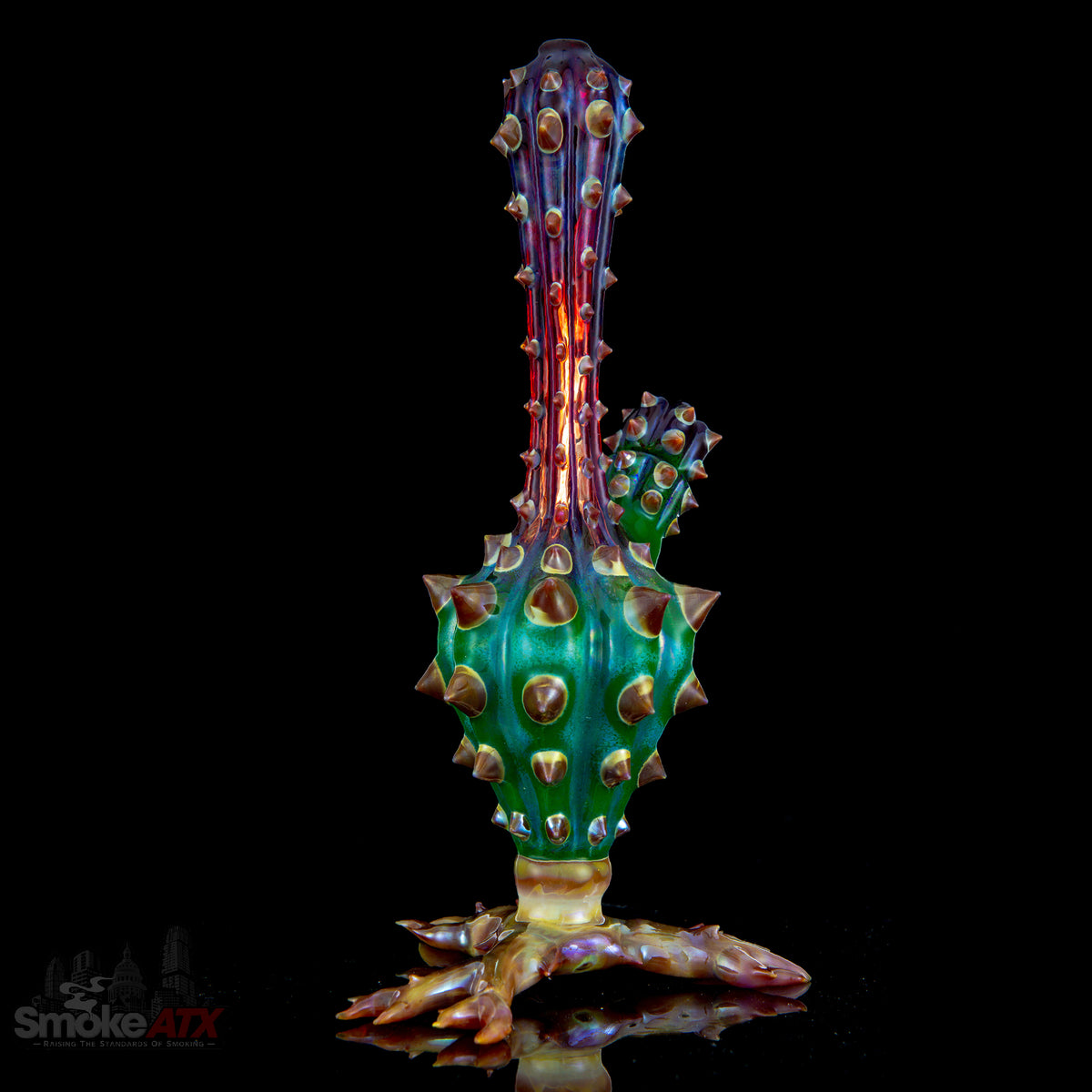 Colorful cactus-shaped glass bubbler vase by Unparalleled Glass, featuring vibrant mixed colors and intricate design details.