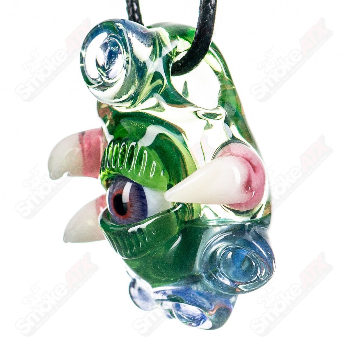 Salt Glass Plantphibian Neptunium Ion UV Pendant featuring vibrant glass art with UV-reactive elements and intricate design.