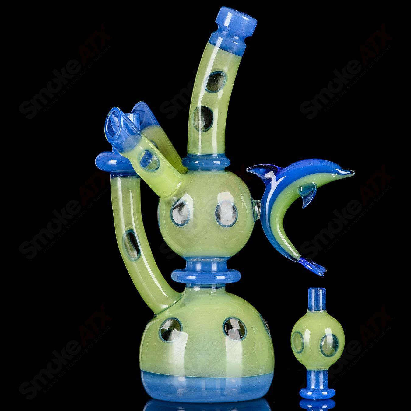 RAM Porthole Xhalerator Robert Mickelsen glass concentrate rig with a distinctive porthole design and intricate glasswork.
