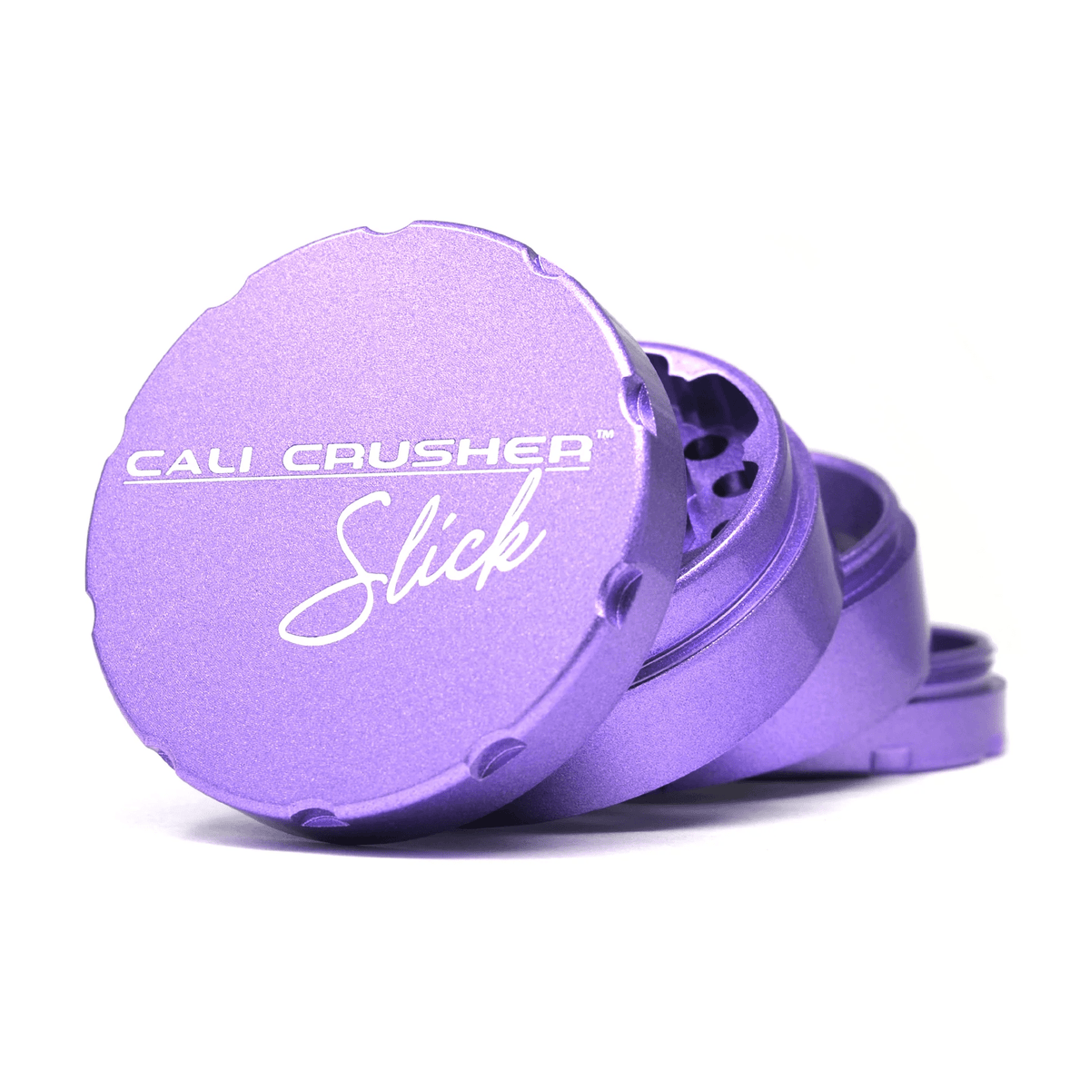 Purple 2.5-inch Cali Crusher 4-piece metal grinder with Slick design, used for grinding herbs and herbs.