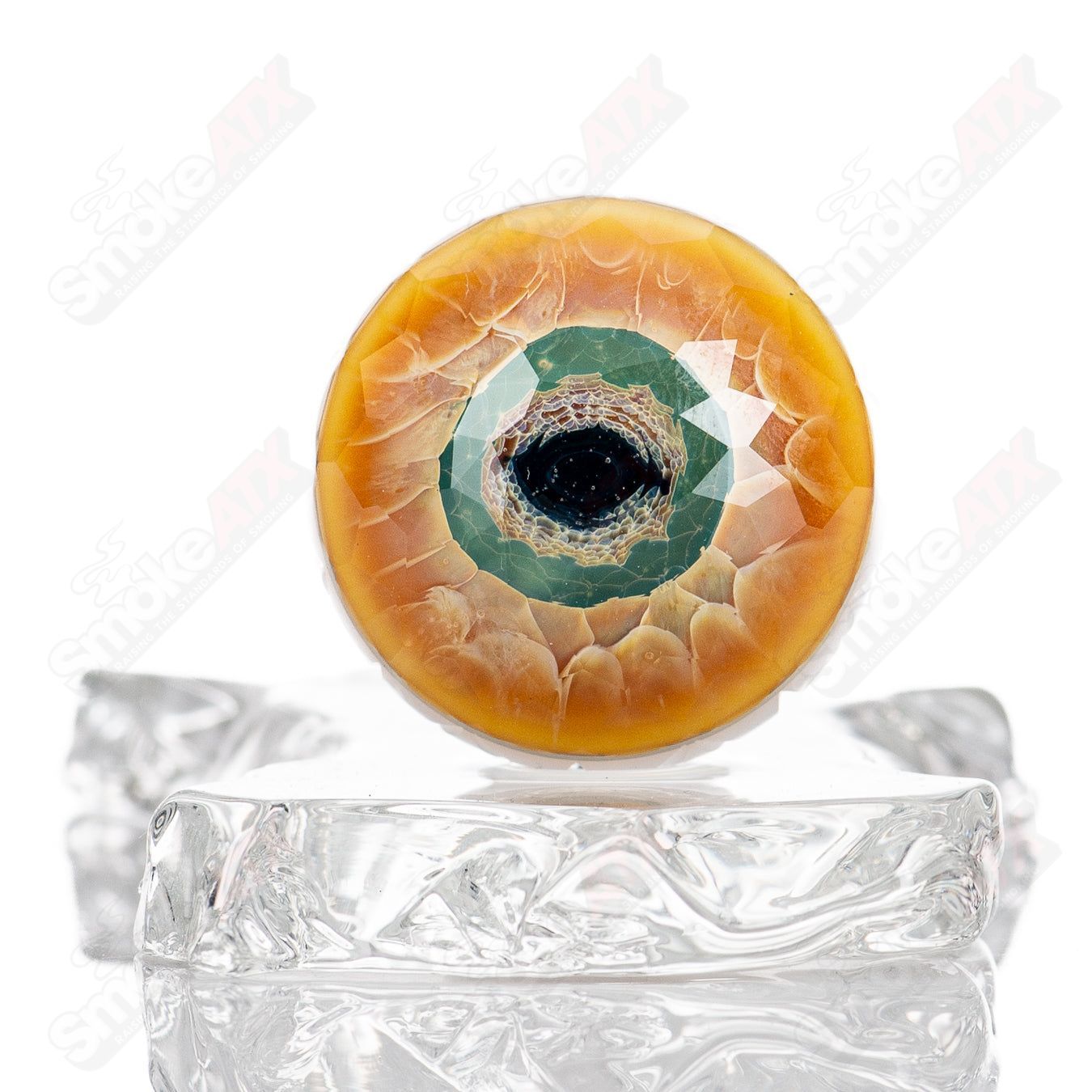 Faceted Dragon Eye Marble by Indo Glass, a colorful heady glass marble with intricate faceted patterns and a dragon eye design.