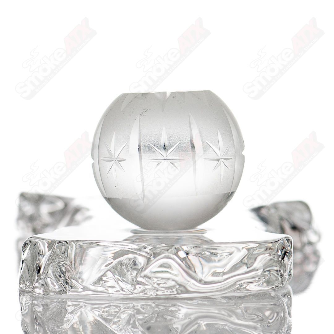 Glass marble from Fatal Facets Gemini Fatal Facets Marble #1 with swirling patterns in shades of gray and white.