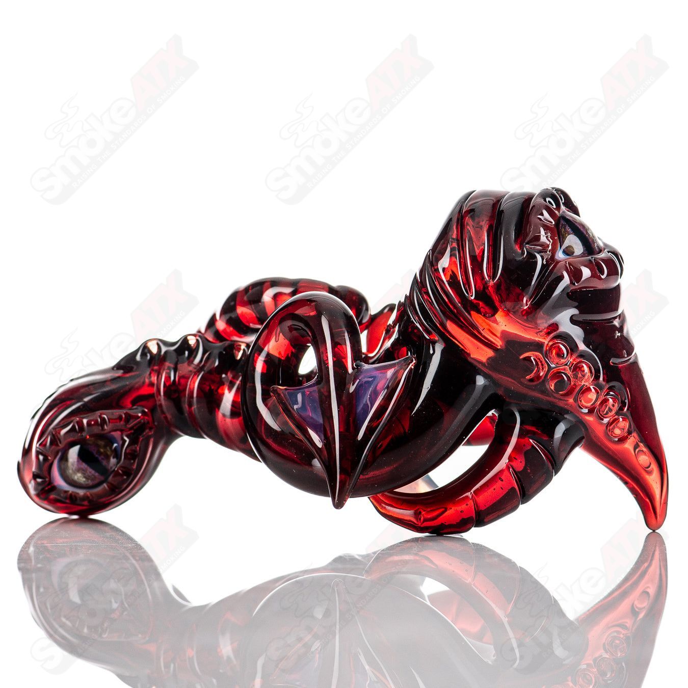 Clear Mako Glass hand pipe with colorful swirling designs, compact and smooth, perfect for easy handling and use.