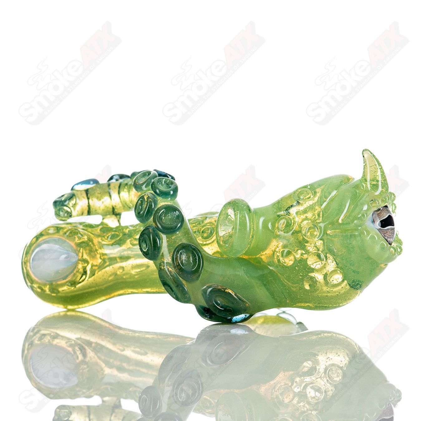 Mako Glass Slime Spoon hand pipe made of heady glass, featuring a colorful slime design and smooth bowl for smoking.