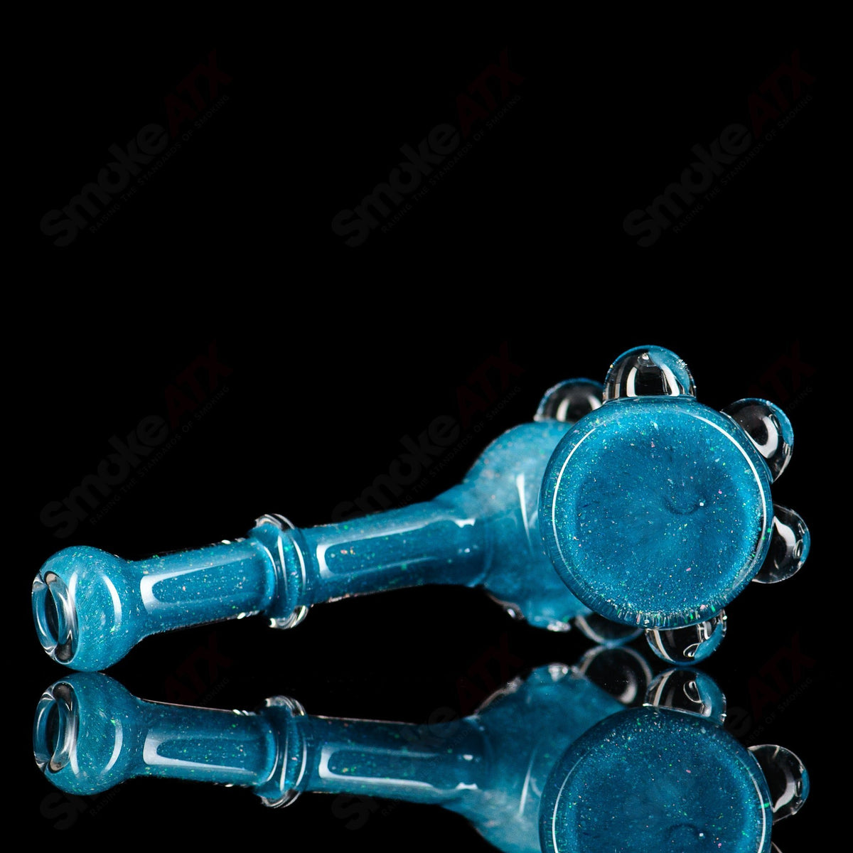 Hand pipe from Pacer Glass featuring a colorful, artistic design with a smooth glass body and a rounded bowl for smoking.