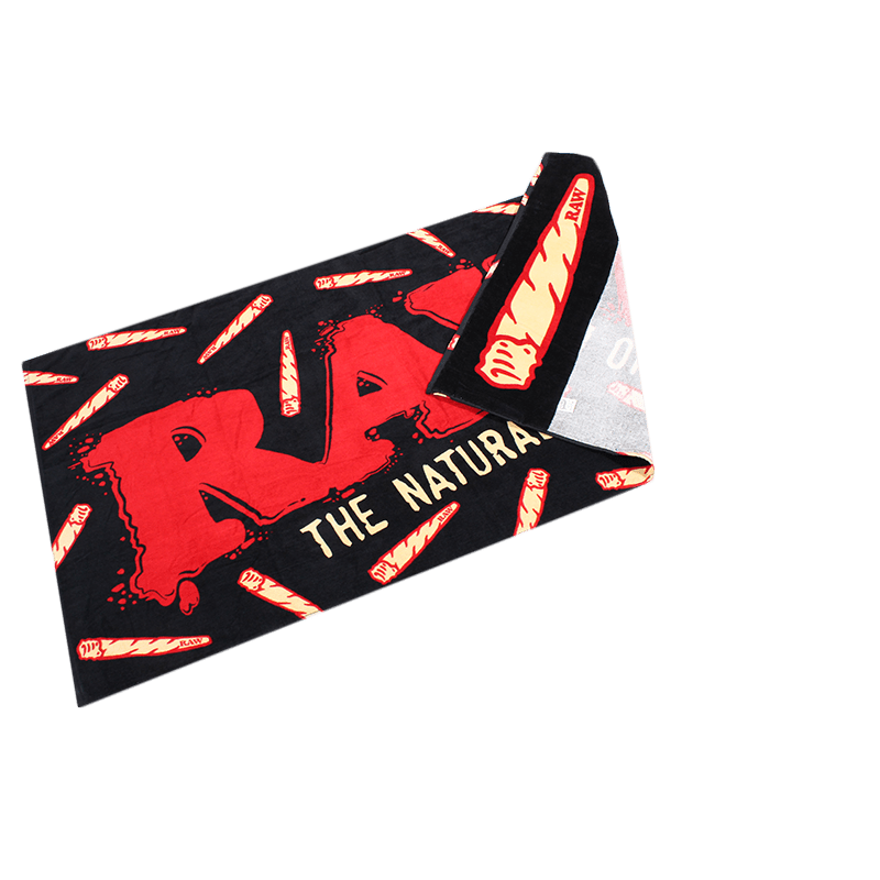 RAW beach towel with stash pocket featuring vibrant design, soft fabric, perfect for lounging at the beach or poolside.