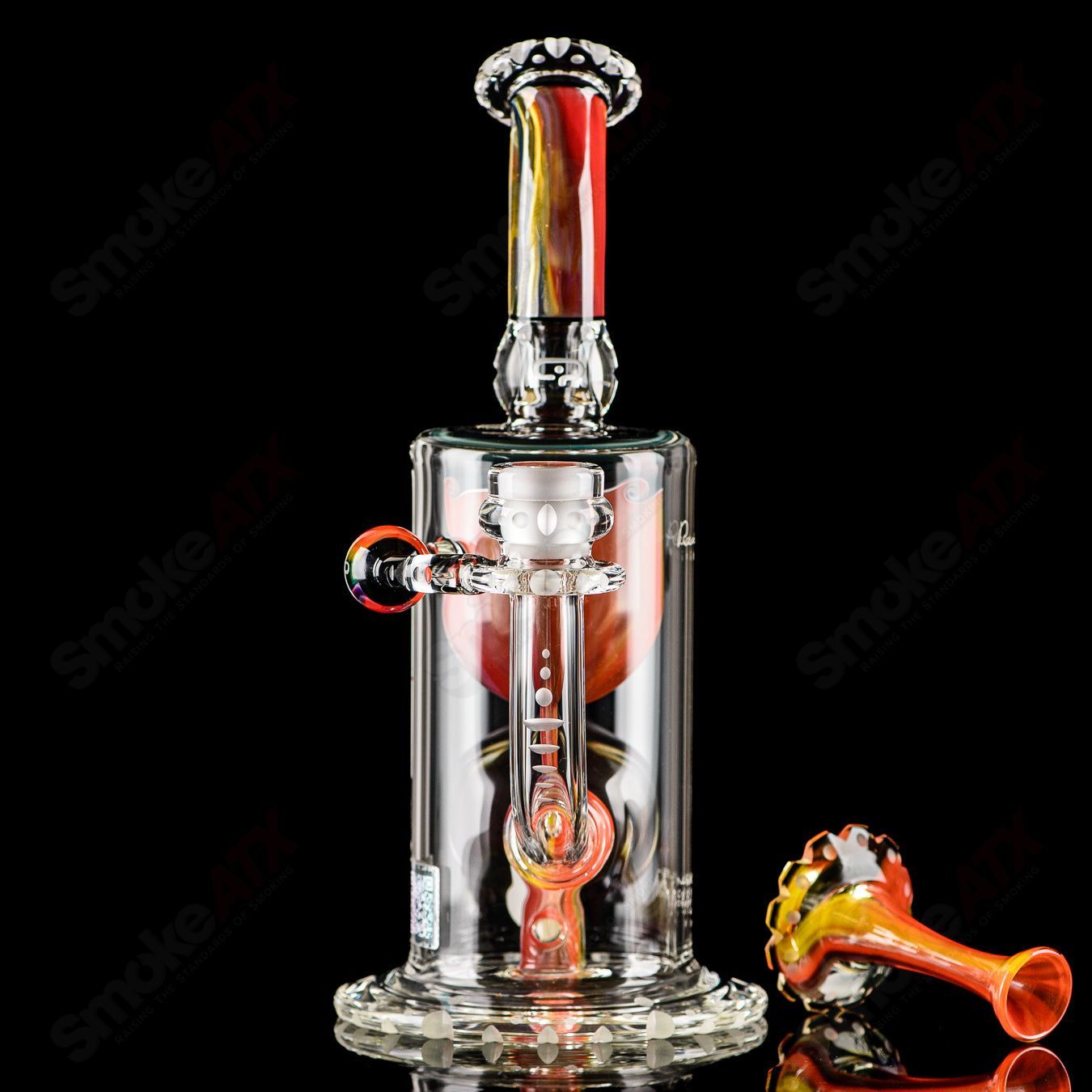 Mobius Recurve Accent Series glass concentrate rig with intricate design and clear glass construction.