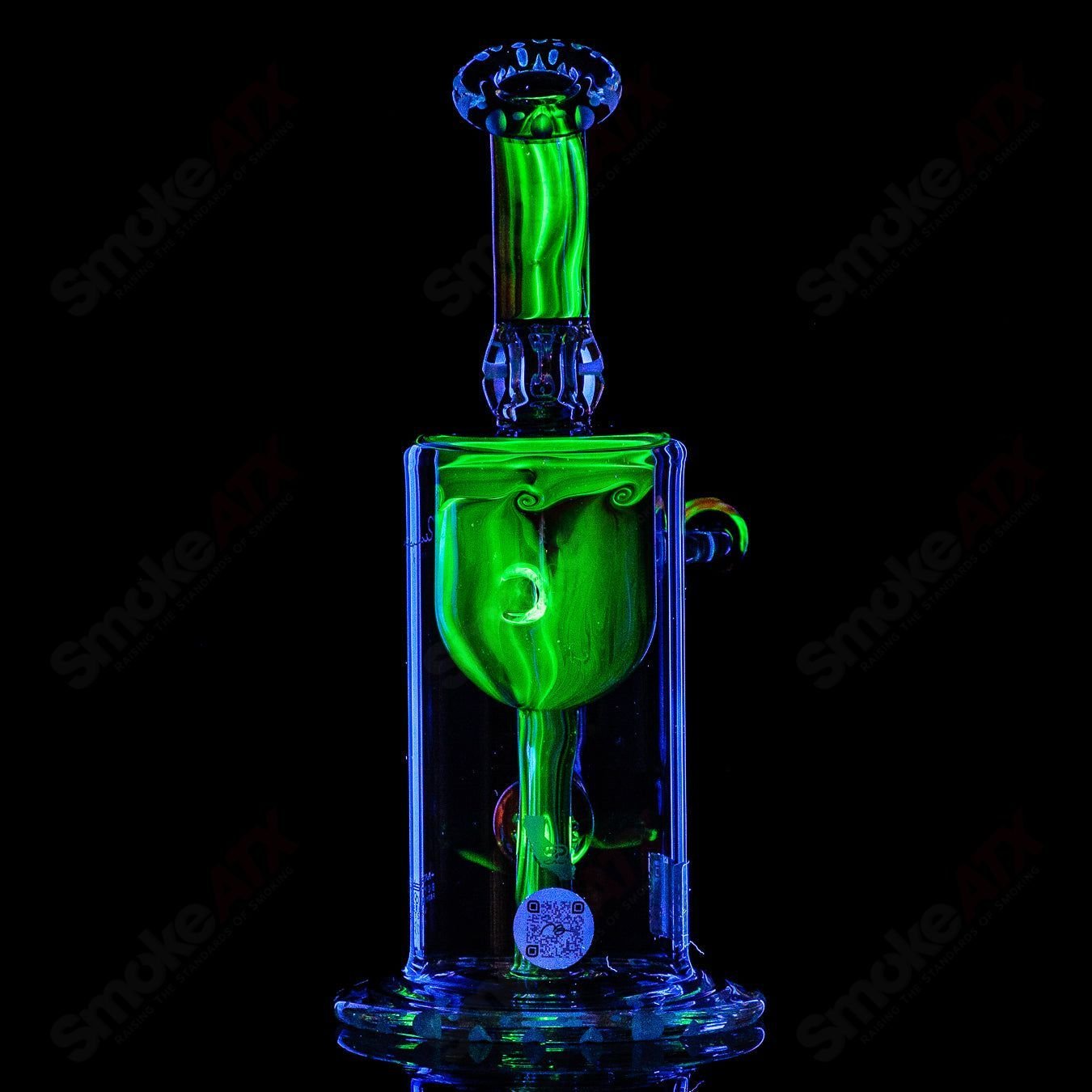 Mobius Recurve Accent Series glass concentrate rig with intricate design and clear glass body, showcasing artistic craftsmanship.